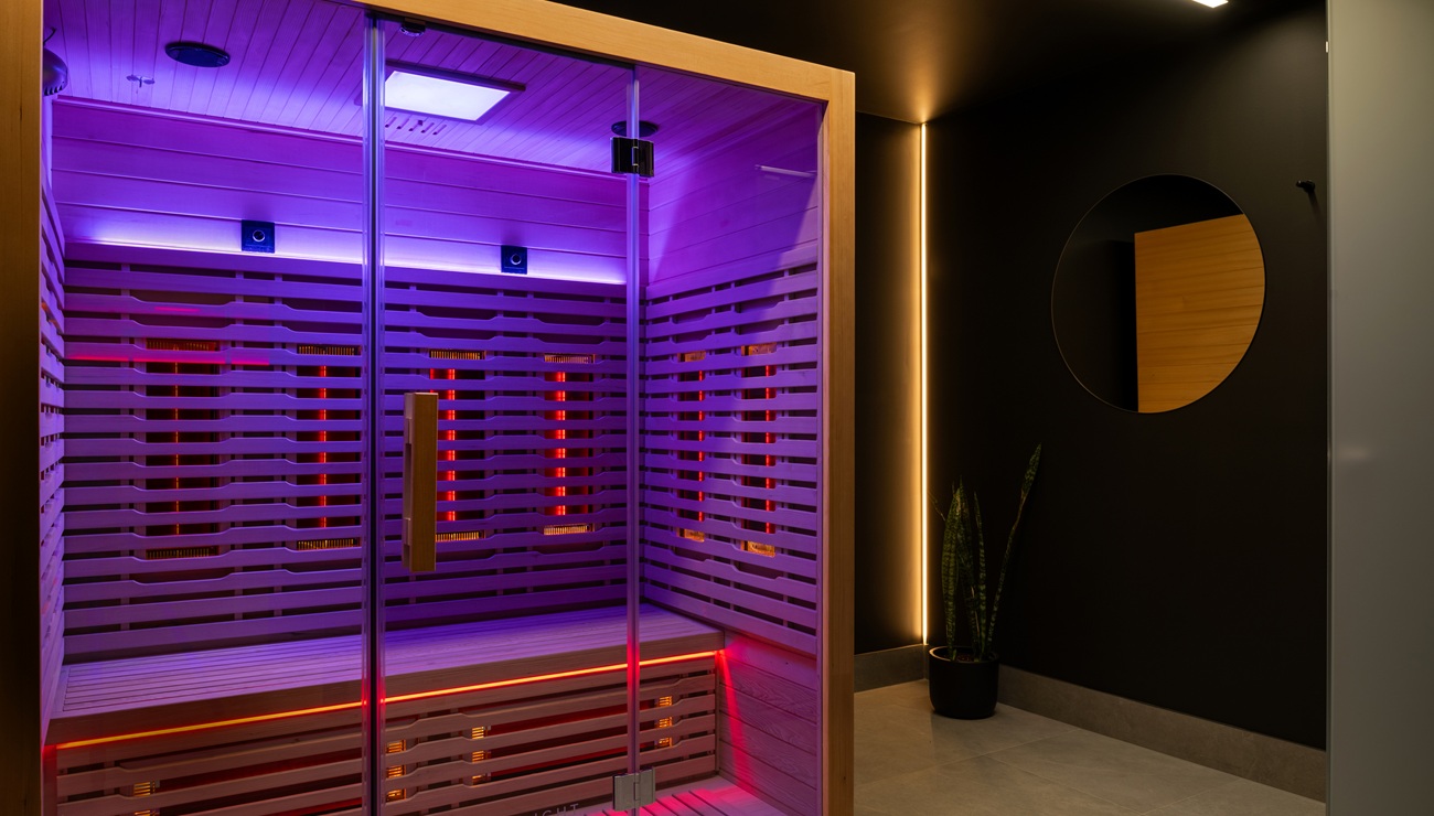 private wellness suite with infrared sauna and red light panel
